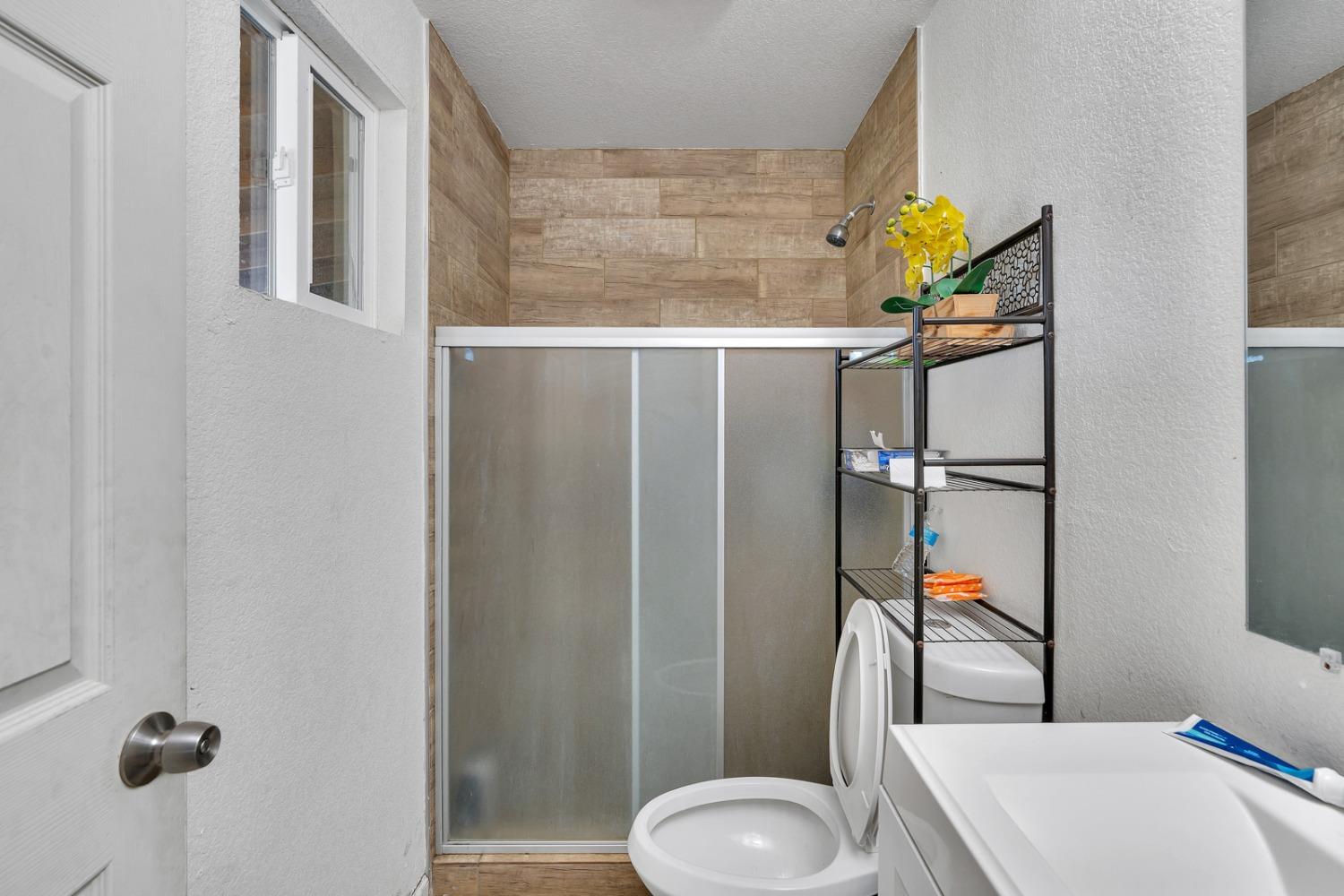 509 Kerr Avenue Modesto, CA 95354 - Photo 47 of 55 a bathroom with a sink toilet and shower