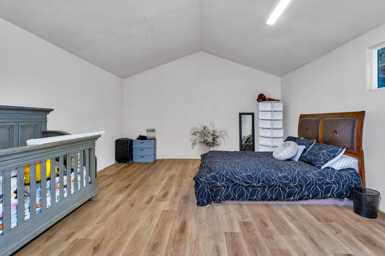 509 Kerr Avenue Modesto, CA 95354 - Photo 48 of 55 a bedroom with a bed and dresser