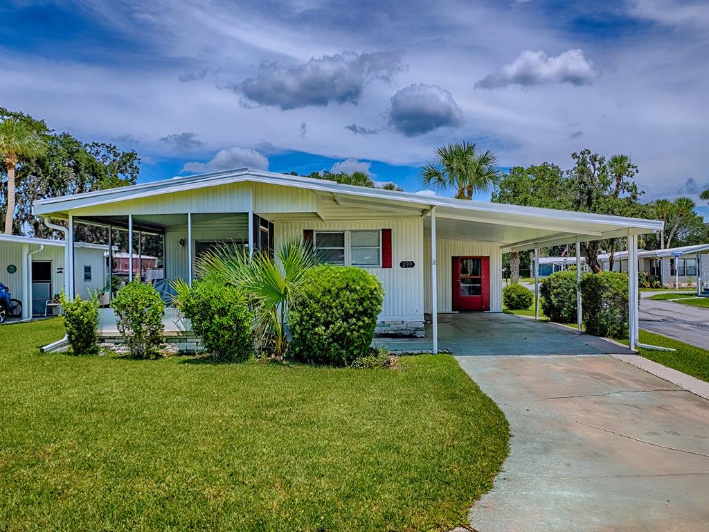 299 Country Club Boulevard Eustis, FL 32726 - Photo 1 of 1 a front view of house with yard and green space