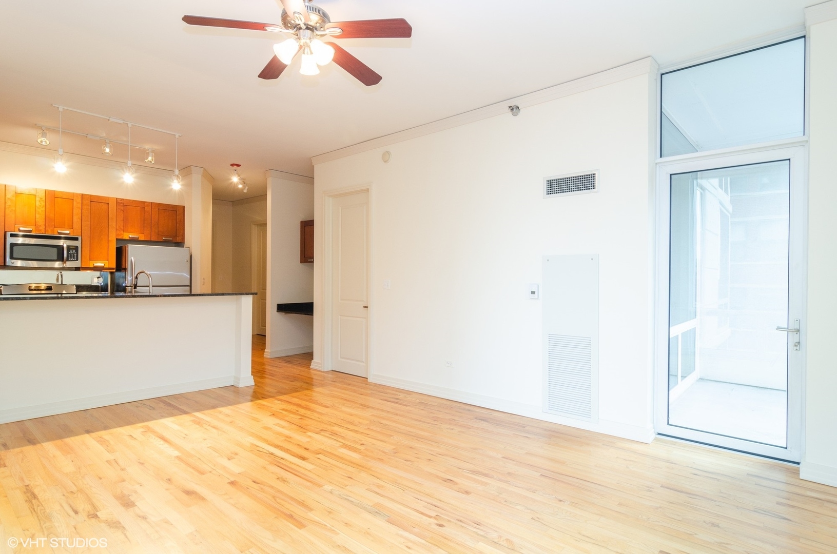170 West Polk Street, Unit 906 Chicago, IL 60605 - Photo 9 of 18 a view of a kitchen with a dishwasher and a refrigerator