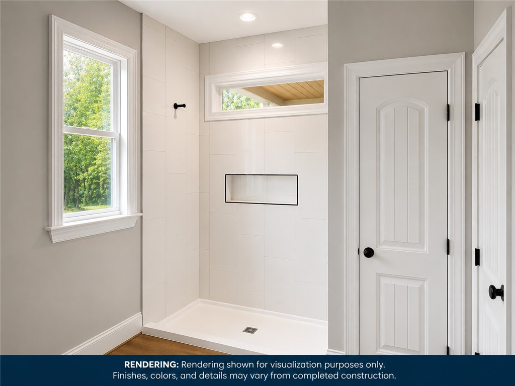 513 Quail Hollow Road Anderson, SC 29621 - Photo 22 of 39 This bathroom features a sleek tiled shower and ample natural light.