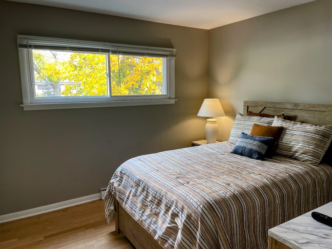 543 South 7th Street West Dundee, IL 60118 - Photo 8 of 12 a bedroom with a bed and a window