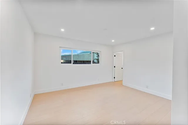 a bathroom with a shower and a glass door