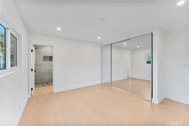 a bathroom with a toilet sink and shower