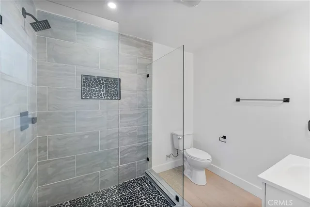 a view of an empty room with a fireplace