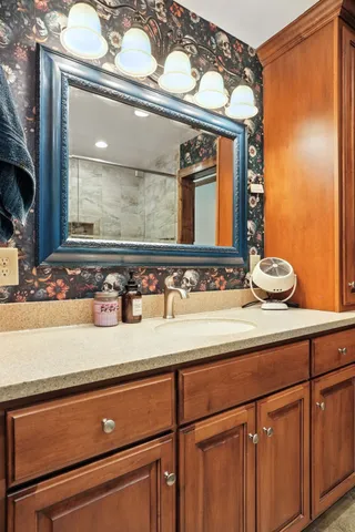 a bathroom with a sink and a mirror