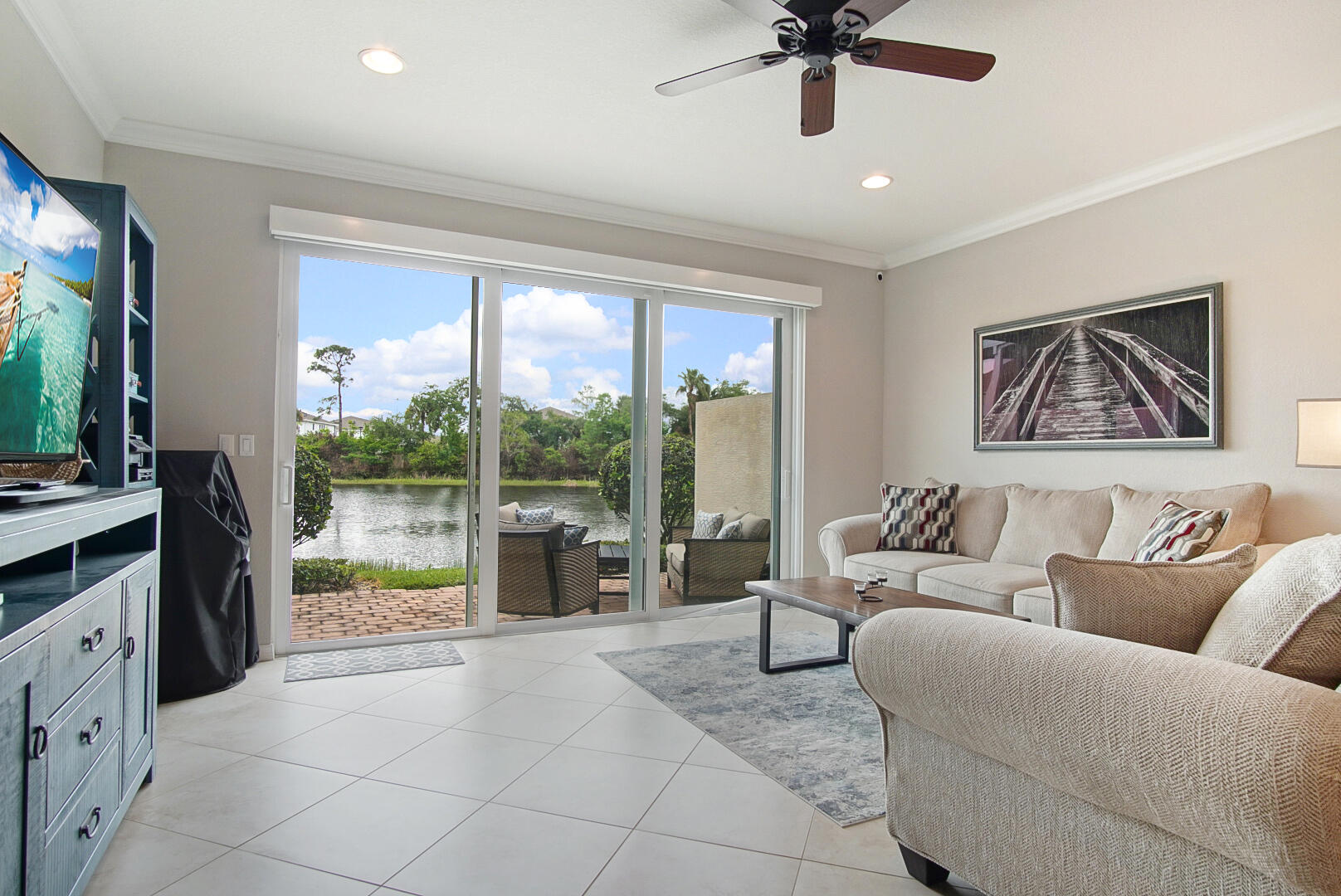 638 Southwest Glen Crest Way Stuart, FL 34997 - Photo 12 of 32 a living room with furniture and a large window