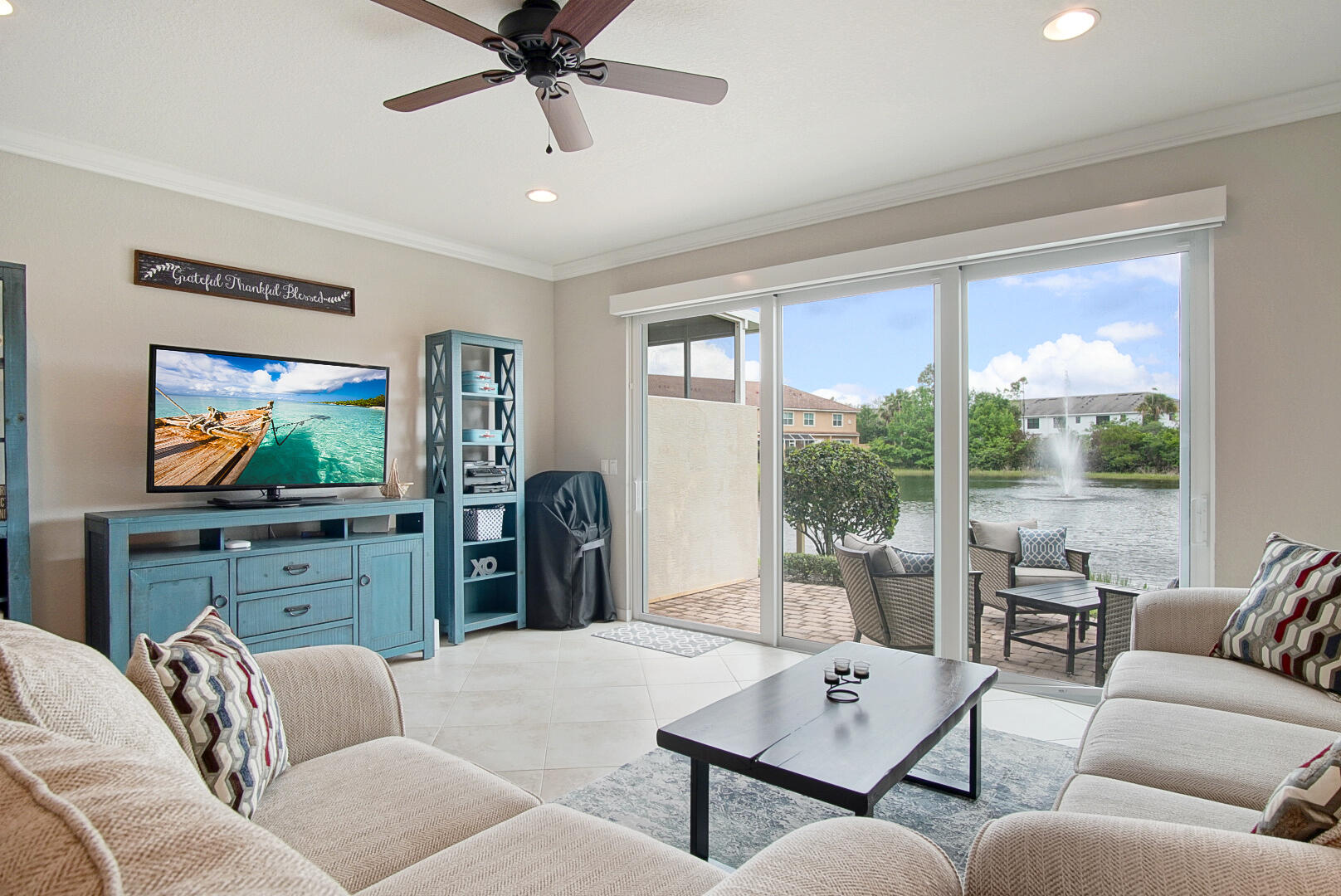 638 Southwest Glen Crest Way Stuart, FL 34997 - Photo 13 of 32 a living room with furniture and a flat screen tv