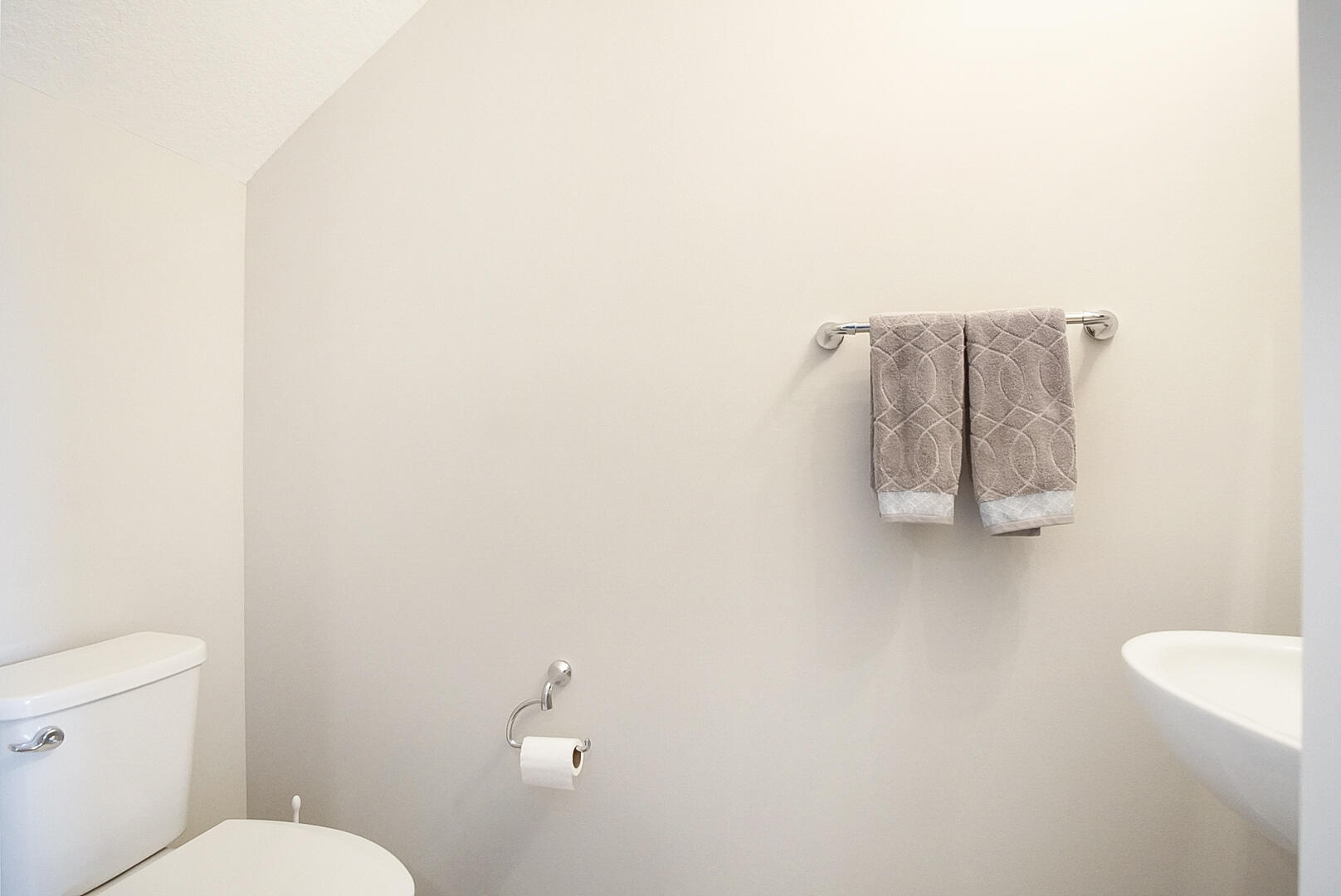 638 Southwest Glen Crest Way Stuart, FL 34997 - Photo 16 of 32 a bathroom with a white toilet and a sink