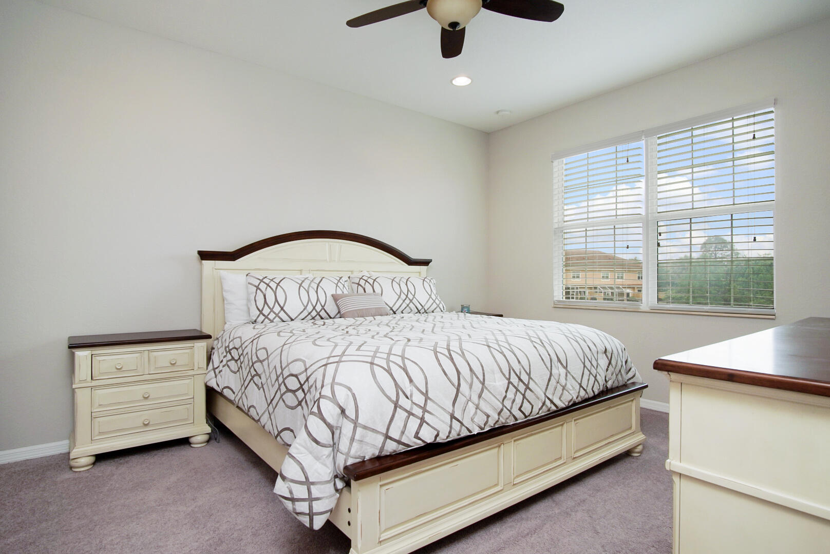 638 Southwest Glen Crest Way Stuart, FL 34997 - Photo 17 of 32 a bedroom with a bed and a window