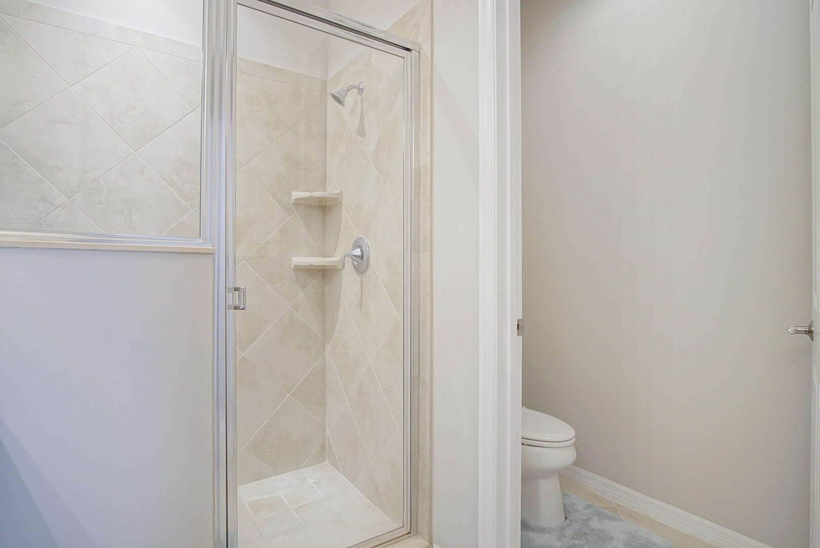 638 Southwest Glen Crest Way Stuart, FL 34997 - Photo 19 of 32 a bathroom with a shower and a toilet