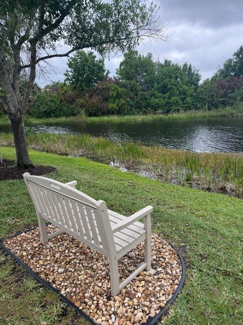 638 Southwest Glen Crest Way Stuart, FL 34997 - Photo 28 of 32 a view of a wooden deck with lake view