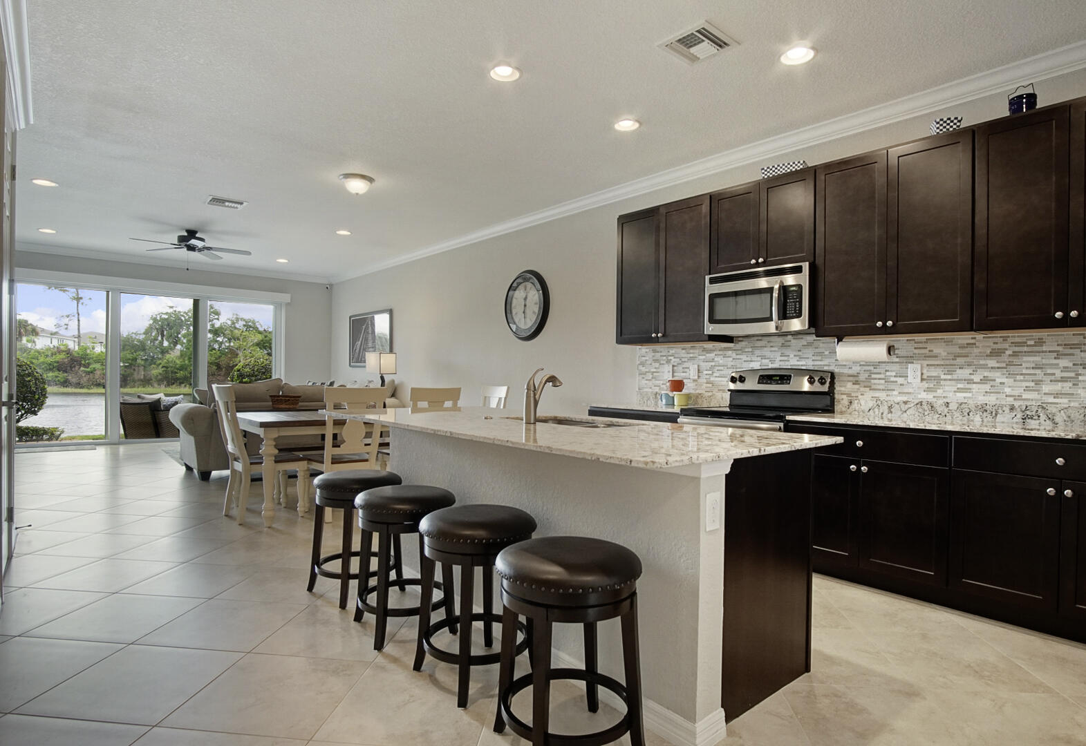 638 Southwest Glen Crest Way Stuart, FL 34997 - Photo 5 of 32 a kitchen with counter top space cabinets and appliances
