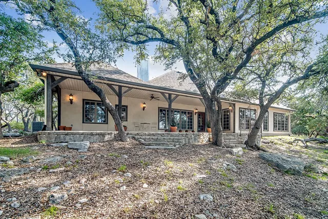 a large tree in front of a house