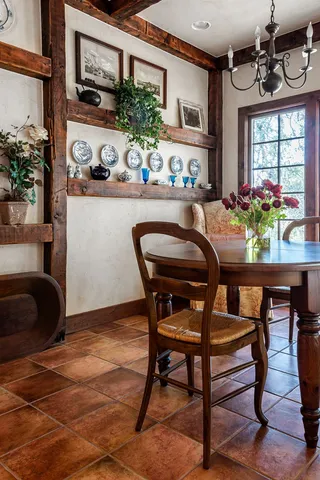 a front view of a house with a sitting area