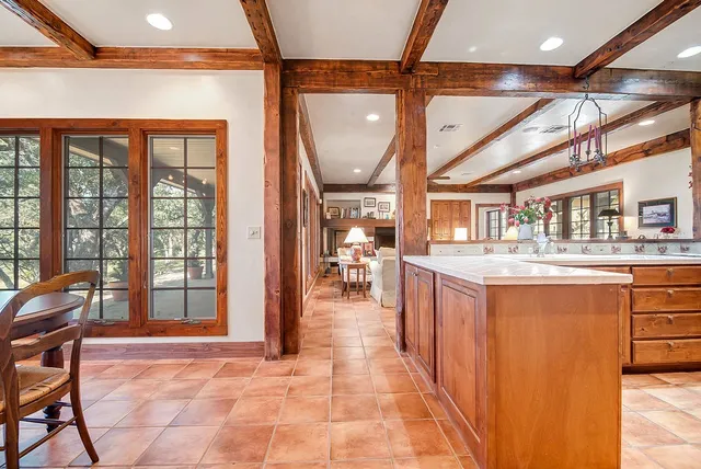 a lobby with furniture and large windows