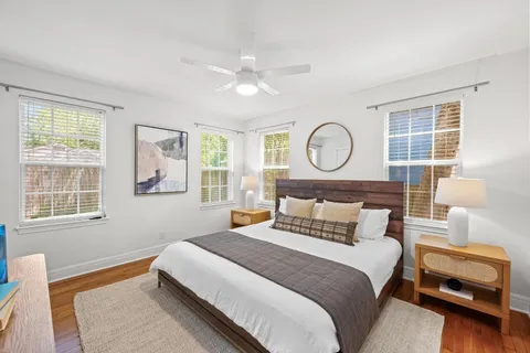 a bedroom with a bed and window