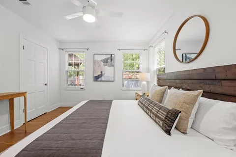 a bedroom with bed and a window