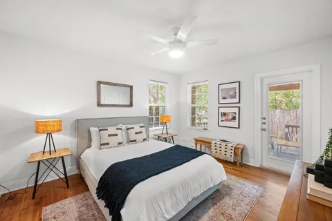 a bedroom with a bed and a chandelier