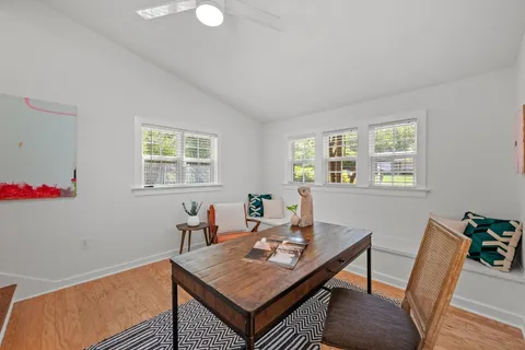 a view of a workspace with furniture