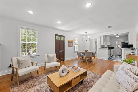 a living room with furniture and a table