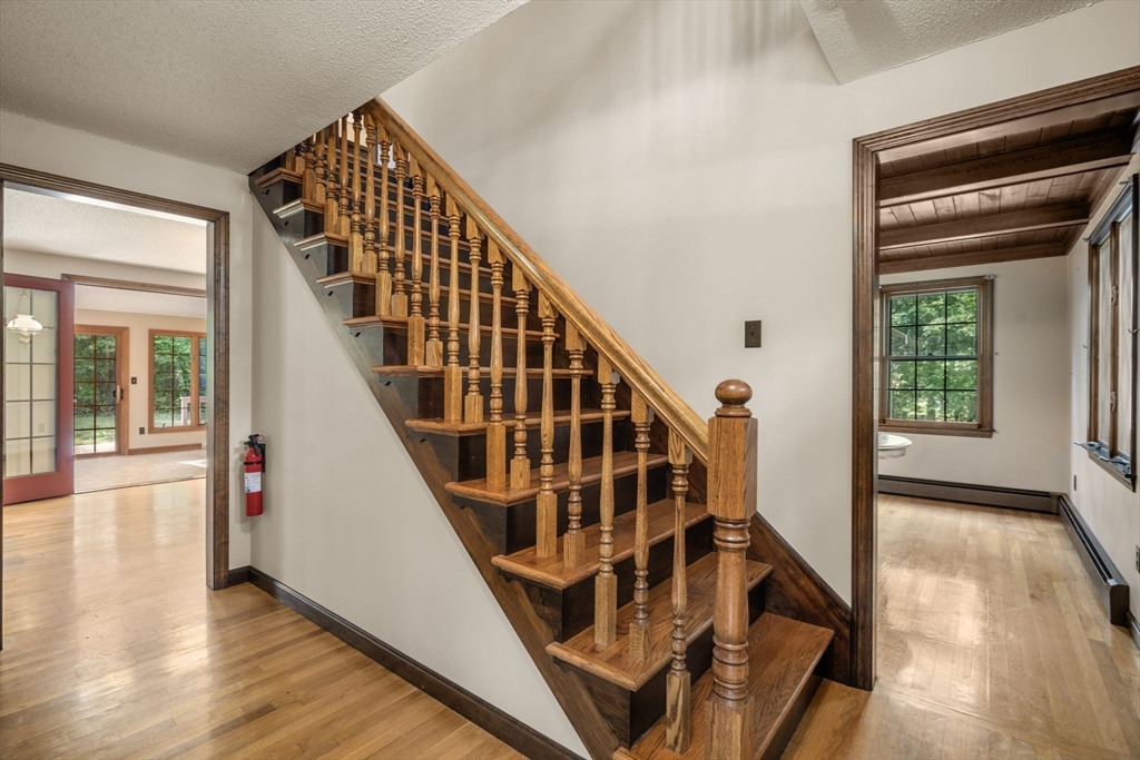 9 Randall Road Rochester, MA 02770 - Photo 23 of 42 a view of an entryway with wooden floor and door