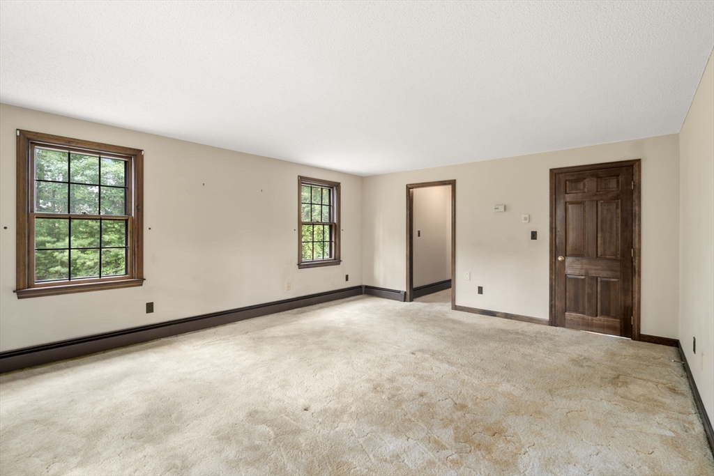 9 Randall Road Rochester, MA 02770 - Photo 25 of 42 an empty room with windows and closet