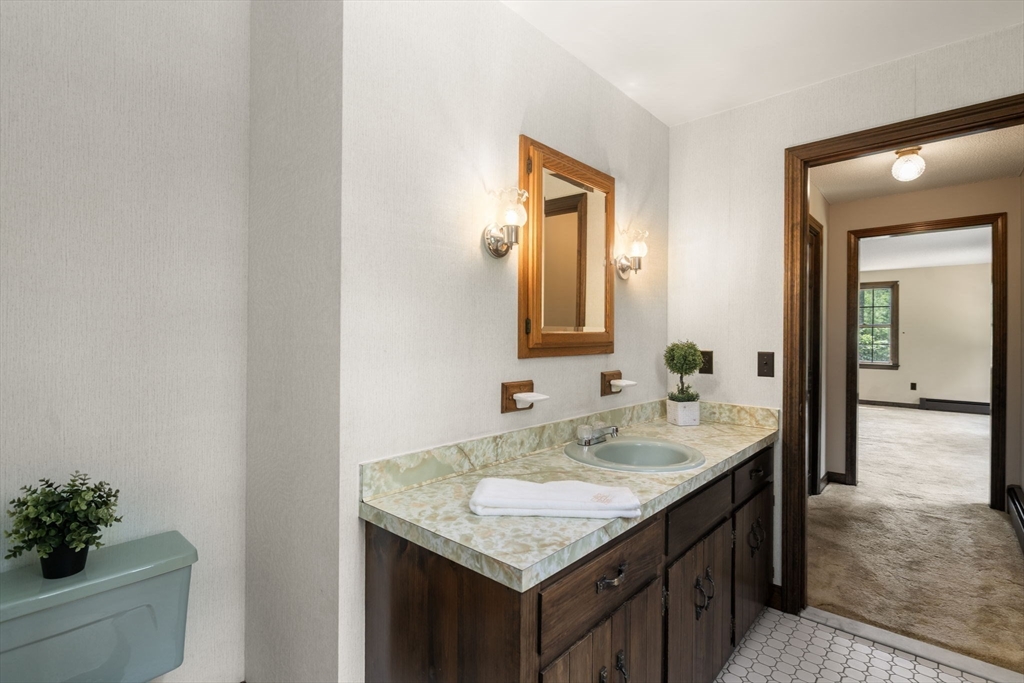 9 Randall Road Rochester, MA 02770 - Photo 29 of 42 a bathroom with a granite countertop sink and a mirror