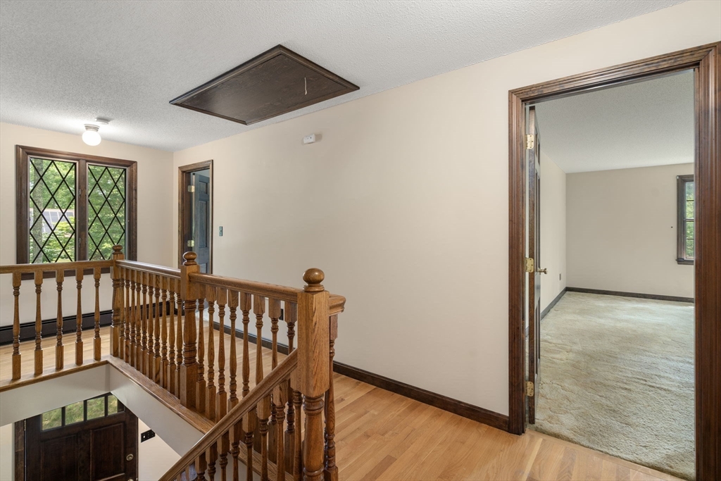 9 Randall Road Rochester, MA 02770 - Photo 35 of 42 a view of hallway with window and wooden floor