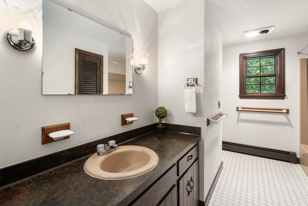 9 Randall Road Rochester, MA 02770 - Photo 36 of 42 a bathroom with a sink and a mirror