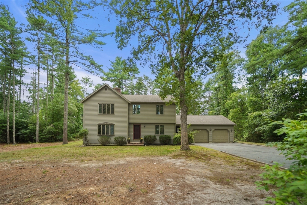 9 Randall Road Rochester, MA 02770 - Photo 5 of 42 a view of a house with a yard and large trees