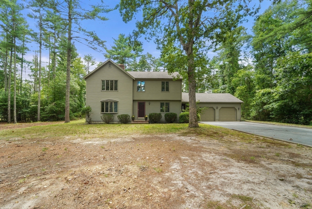 9 Randall Road Rochester, MA 02770 - Photo 6 of 42 a house with trees in the background