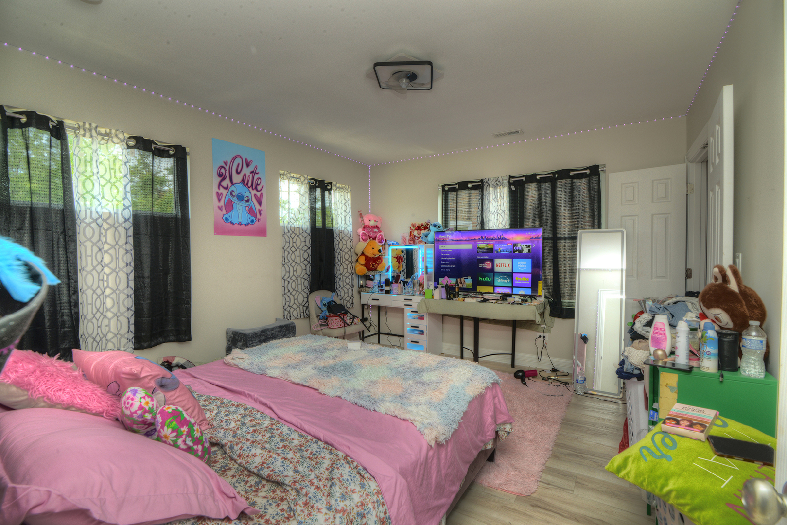 1051 North Springfield Avenue Chicago, IL 60651 - Photo 49 of 50 a bedroom with a bed table and a flat screen tv