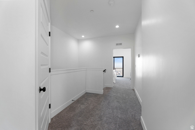 14392 South Champ Cove Draper, UT 84020 - Photo 23 of 31 Hallway with dark colored carpet and recessed lighting