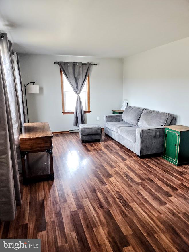 10314 Hyndman Road Manns Choice, PA 15550 - Photo 12 of 54 a living room with furniture and a wooden floor
