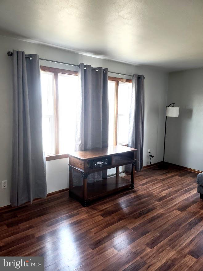 10314 Hyndman Road Manns Choice, PA 15550 - Photo 18 of 54 a room with wooden floor and furniture