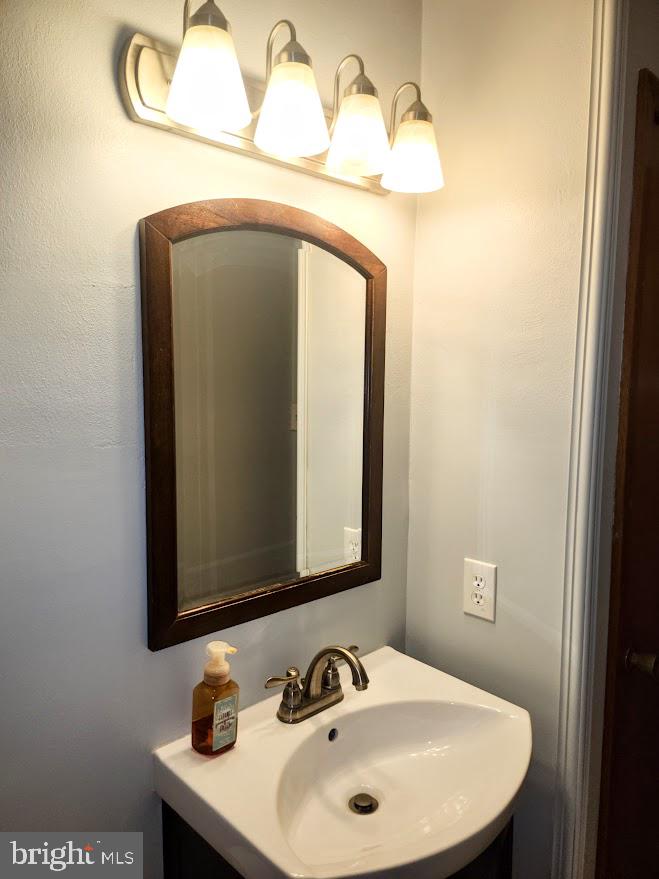 10314 Hyndman Road Manns Choice, PA 15550 - Photo 20 of 54 a bathroom with a sink and a mirror