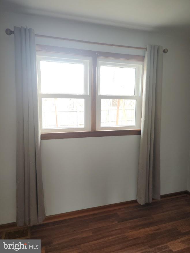 10314 Hyndman Road Manns Choice, PA 15550 - Photo 26 of 54 a view of an empty room with wooden floor and a window