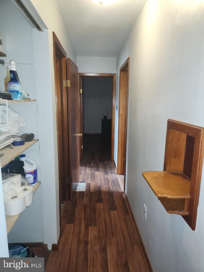 10314 Hyndman Road Manns Choice, PA 15550 - Photo 33 of 54 a view of hallway with furniture and wooden floor