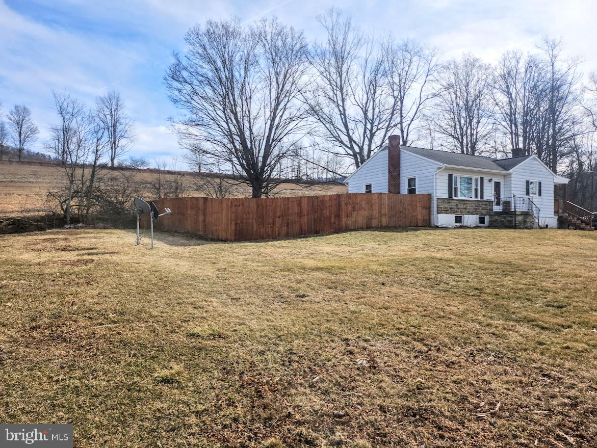 10314 Hyndman Road Manns Choice, PA 15550 - Photo 4 of 54 a view of house with a yard