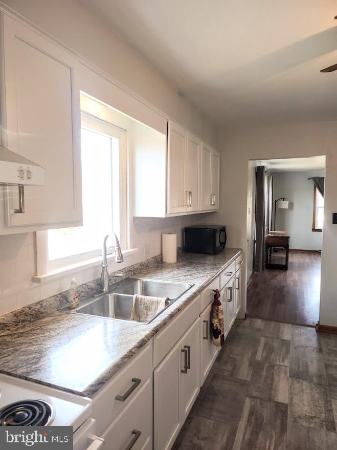 10314 Hyndman Road Manns Choice, PA 15550 - Photo 5 of 54 a kitchen with a sink stove and cabinets