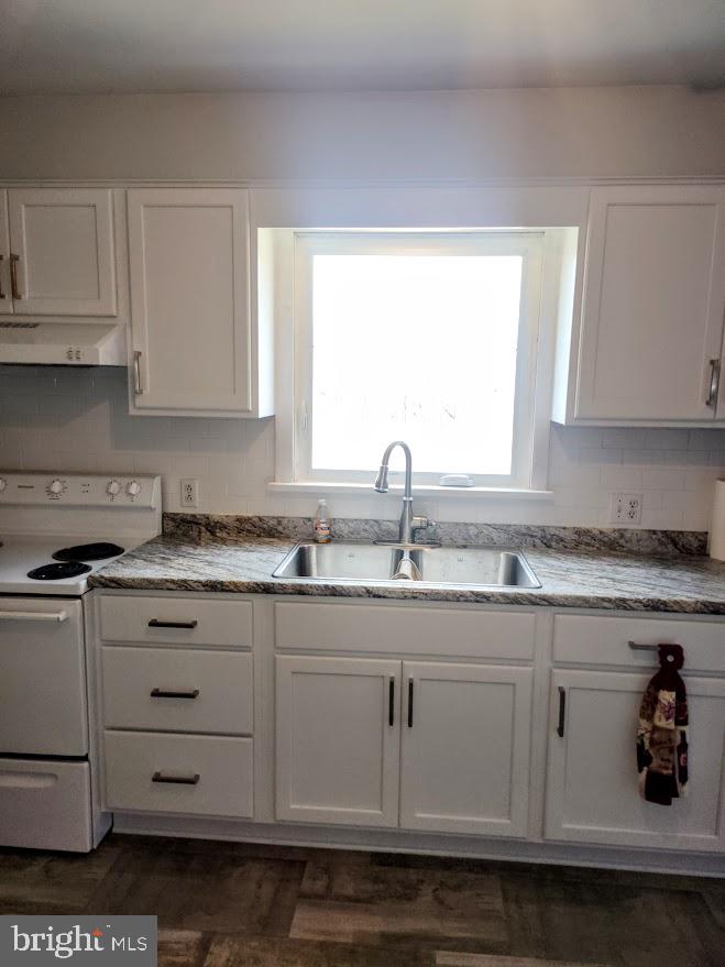 10314 Hyndman Road Manns Choice, PA 15550 - Photo 6 of 54 a kitchen with cabinets appliances a sink and a window