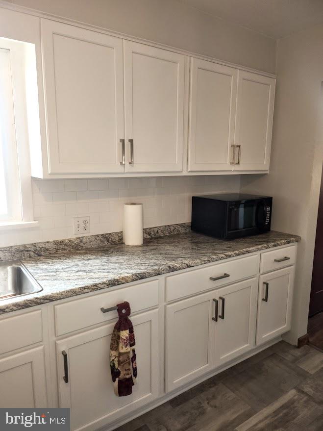 10314 Hyndman Road Manns Choice, PA 15550 - Photo 8 of 54 a kitchen with granite countertop white cabinets and a sink