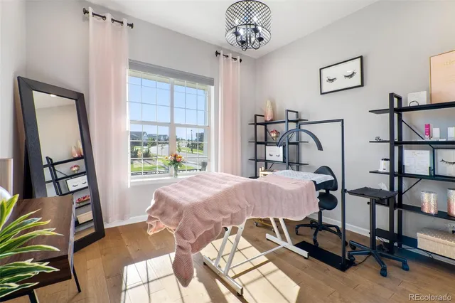 a view of a dining room with furniture and a window