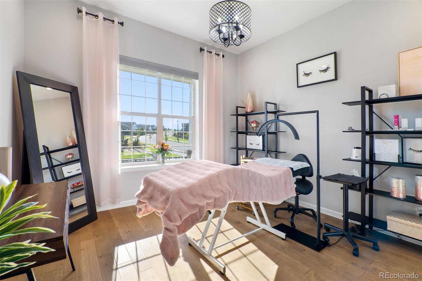 14094 Ivy Court Thornton, CO 80602 - Photo 18 of 44 a view of a dining room with furniture and a window