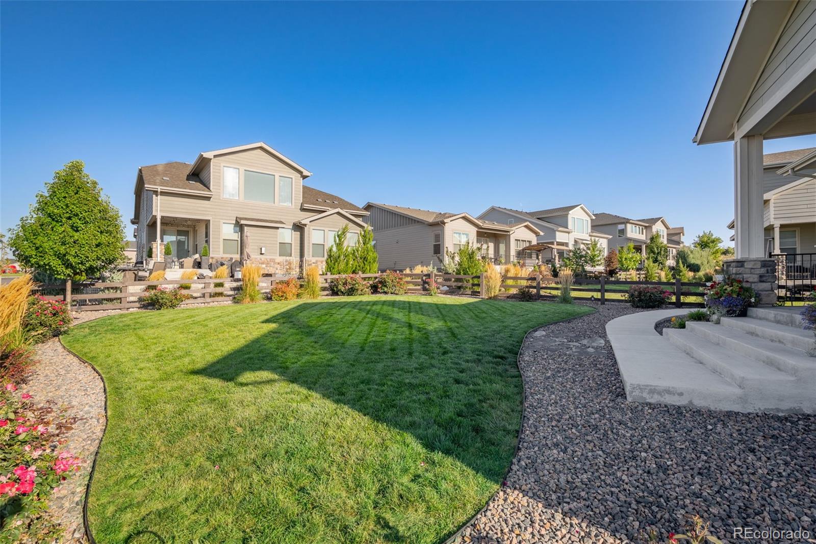 14094 Ivy Court Thornton, CO 80602 - Photo 30 of 44 a front view of a house with a yard