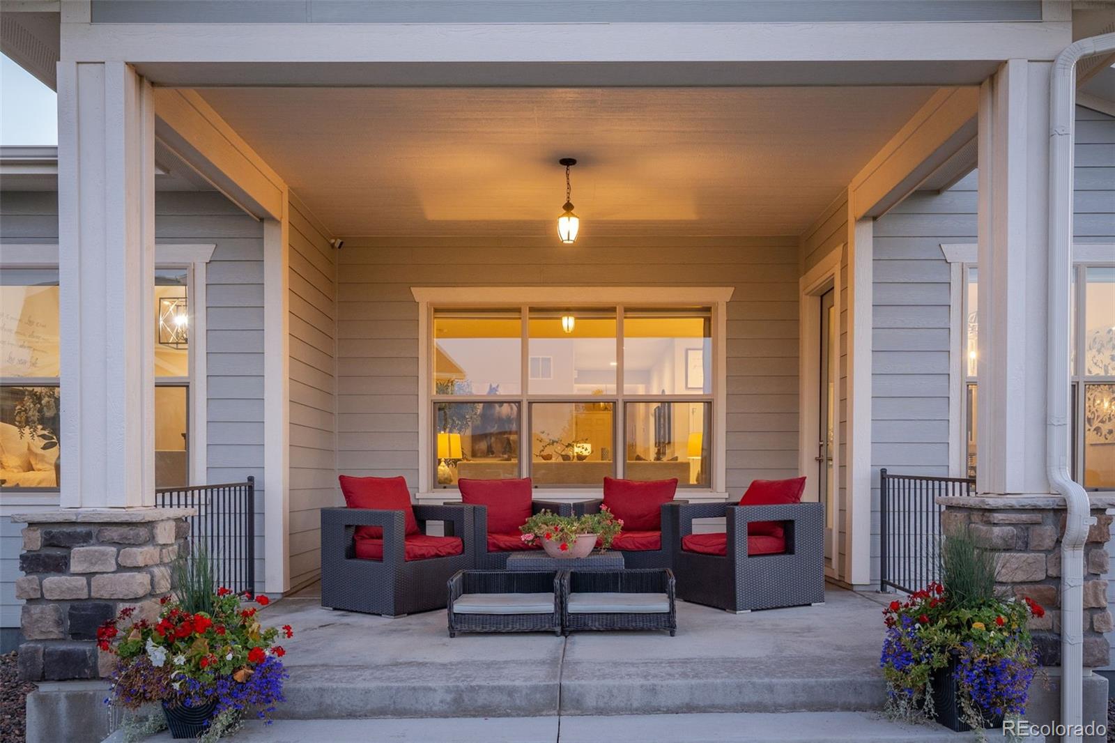 14094 Ivy Court Thornton, CO 80602 - Photo 31 of 44 a living room with furniture and flowers