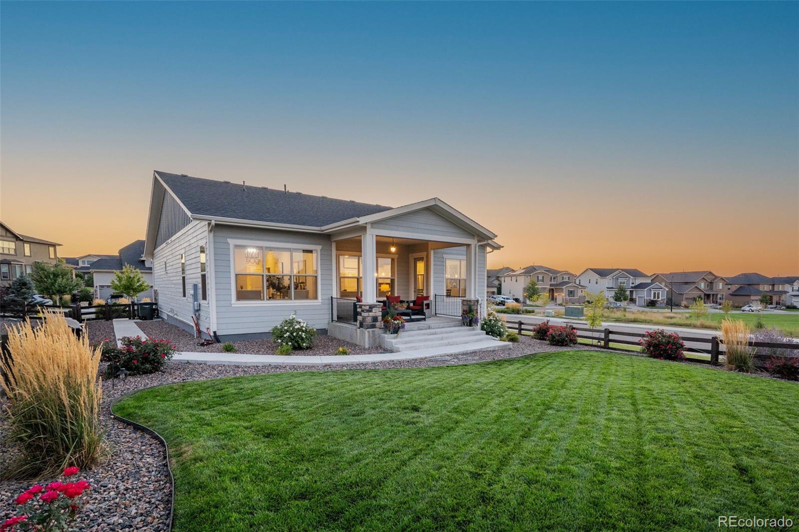 14094 Ivy Court Thornton, CO 80602 - Photo 33 of 44 a view of a house with backyard sitting area and garden