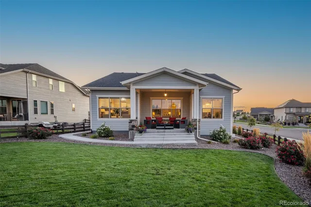 a front view of a house with garden and porch
