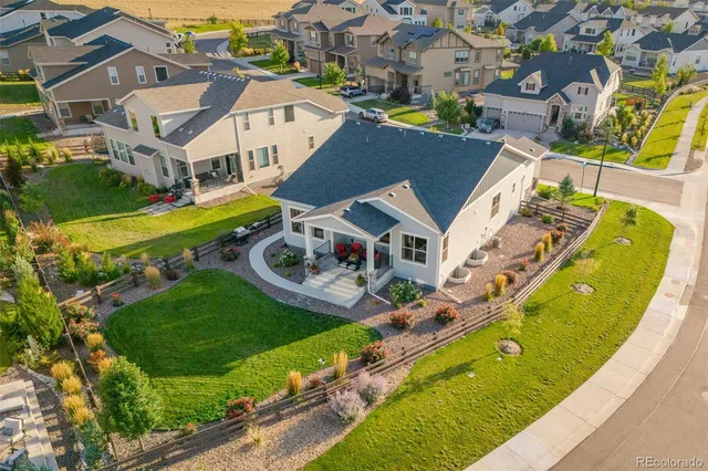 an aerial view of a house with a garden